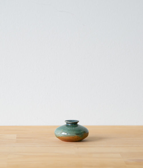Green oribe oil jar