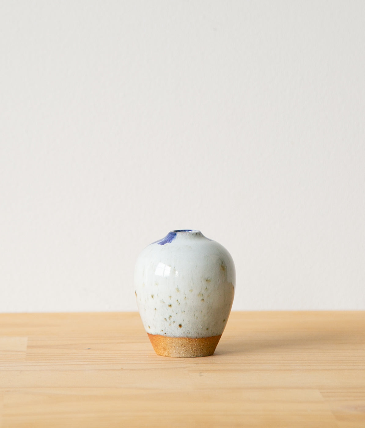 White vase with cobalt feathering