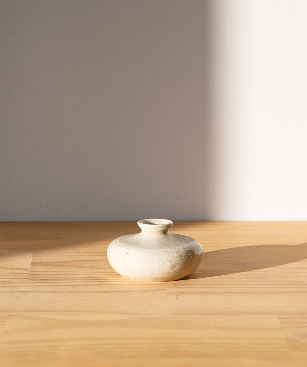 Cream-colored oil jar