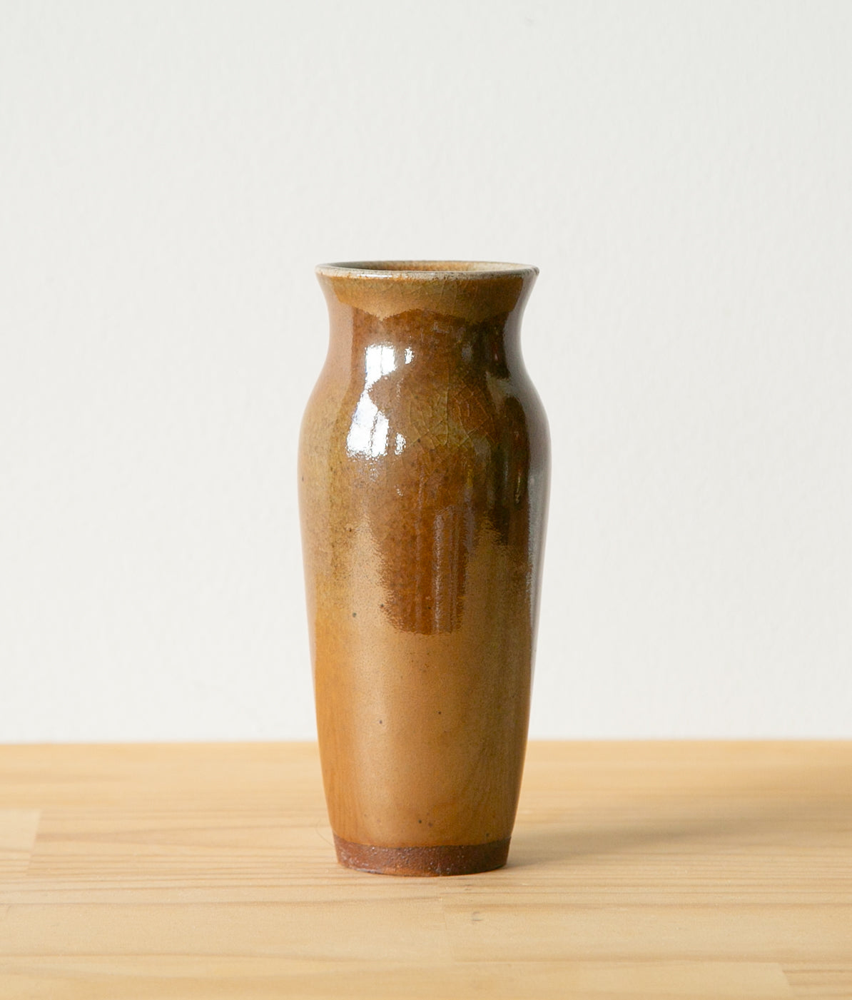 Slim, warm brown vase