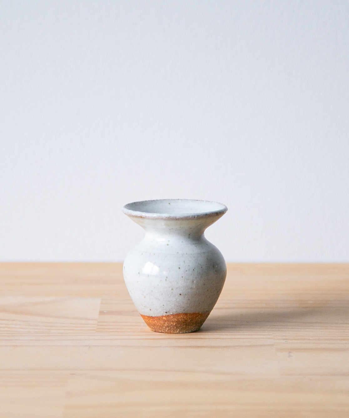 White tulip vase with iron mark