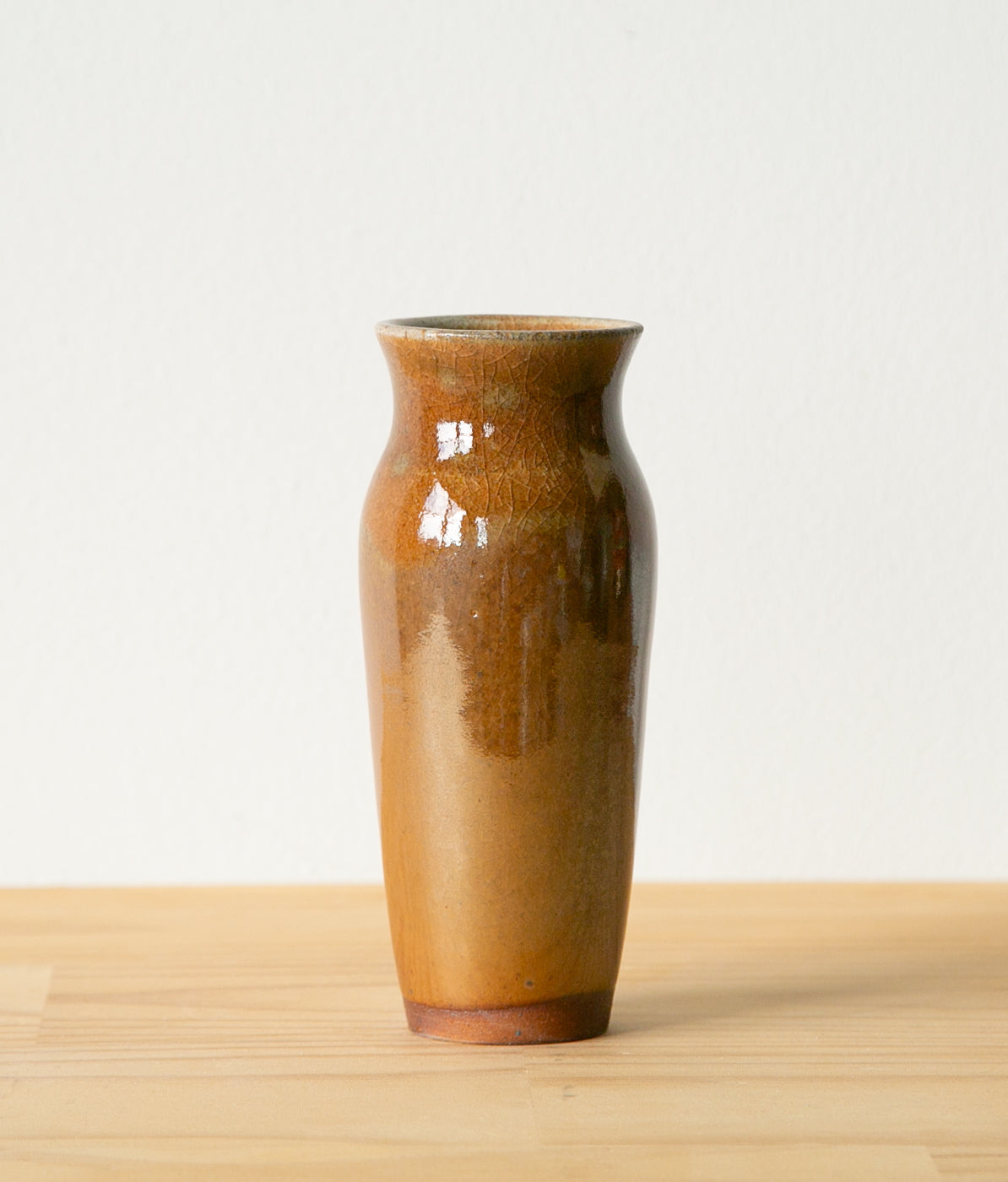 Slim, warm brown vase