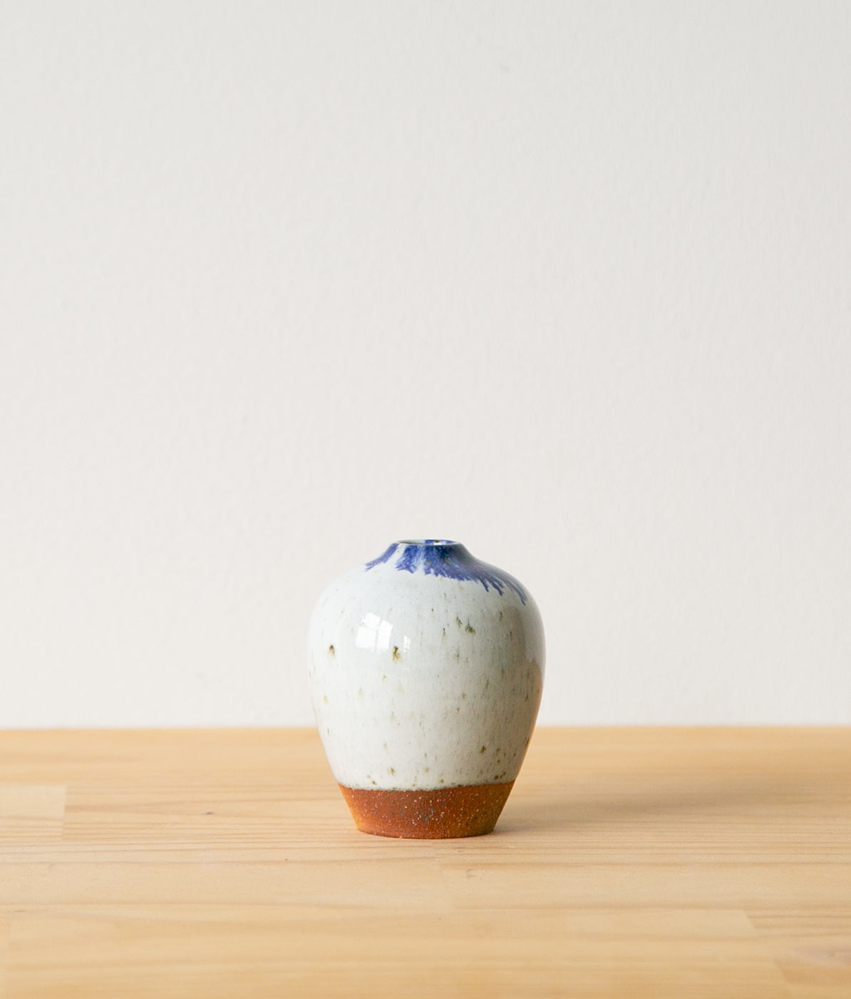 White vase with cobalt feathering