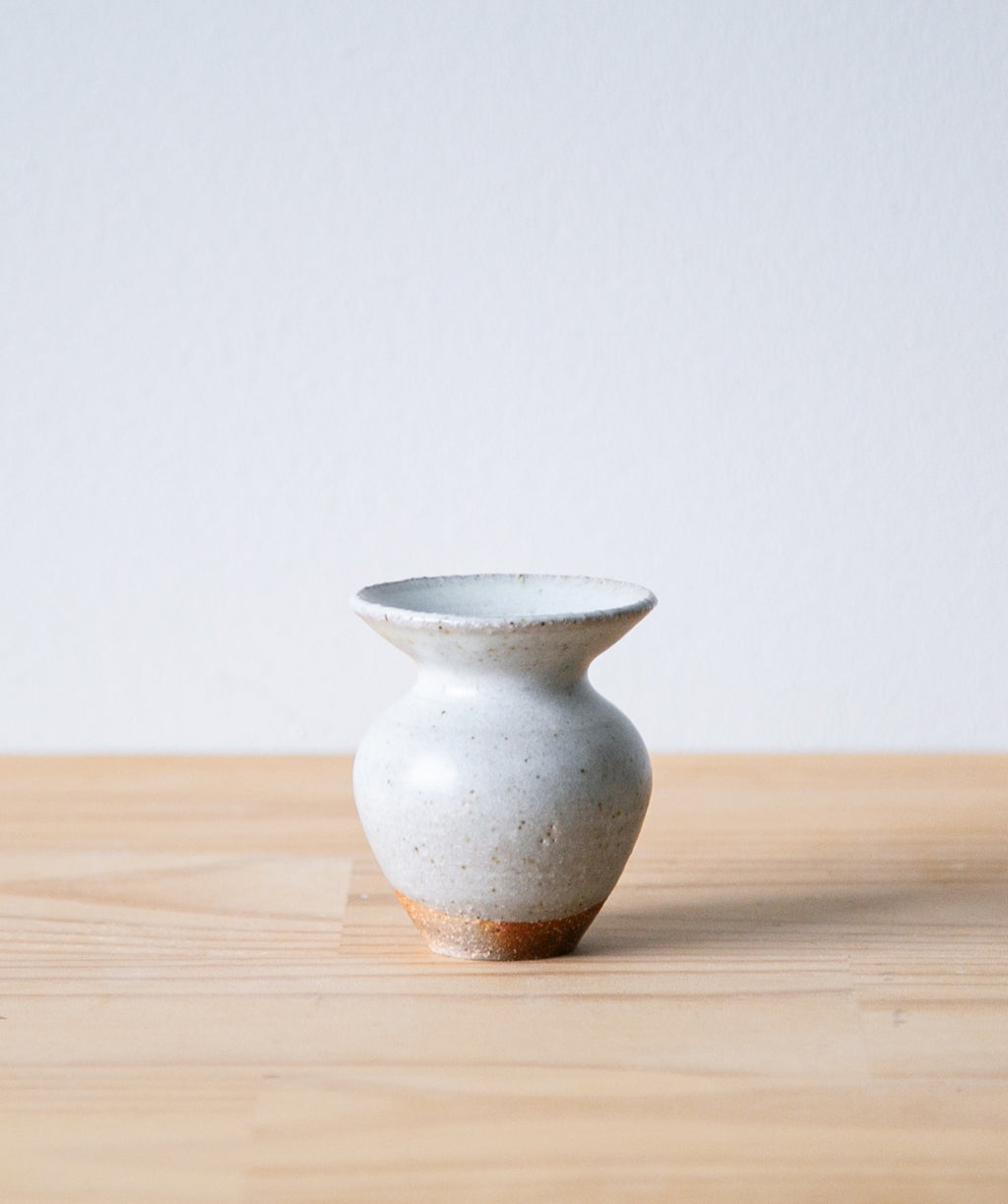 White tulip vase with iron mark