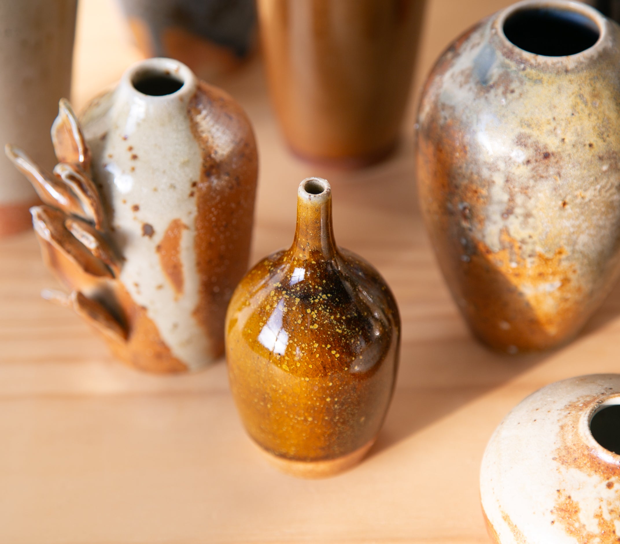 Pollen-flecked brown bud vase