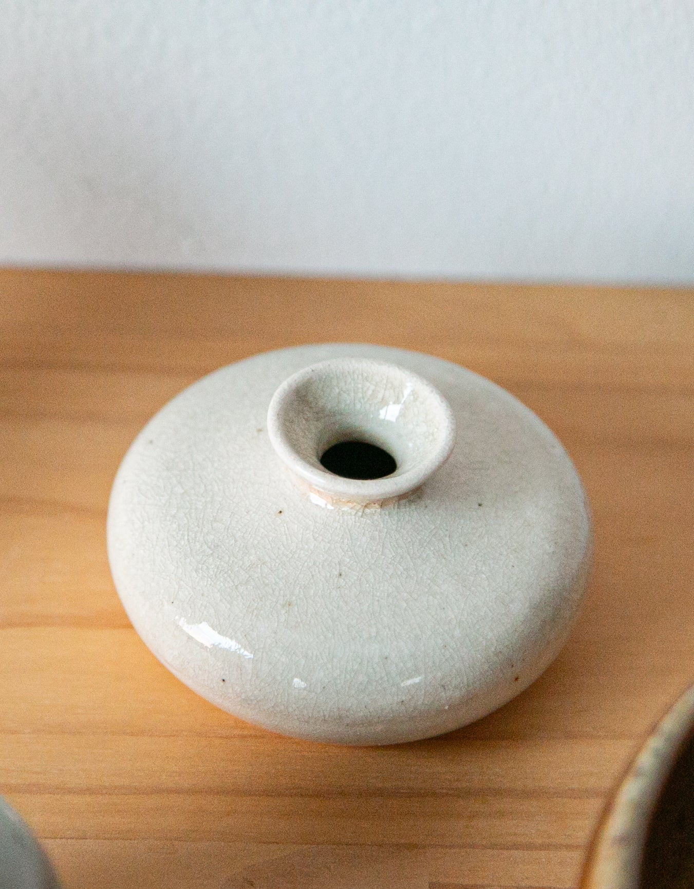 Cream-colored oil jar