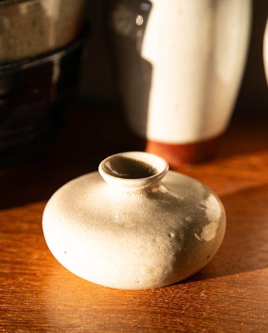 Cream-colored oil jar