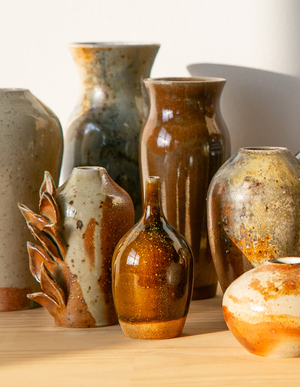 Pollen-flecked brown bud vase