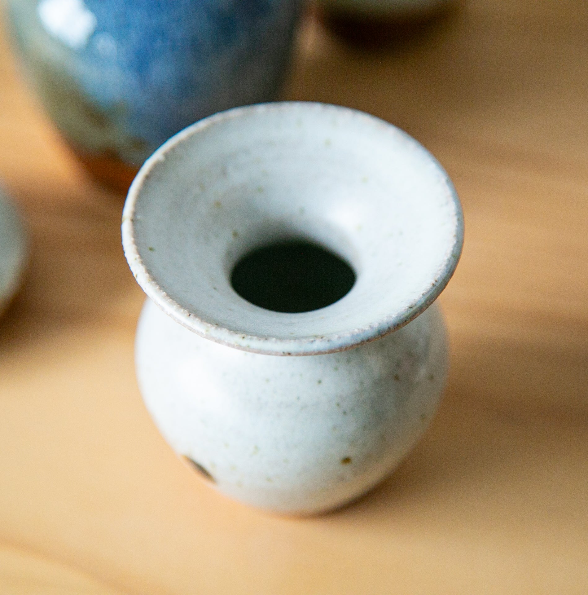 White tulip vase with iron mark