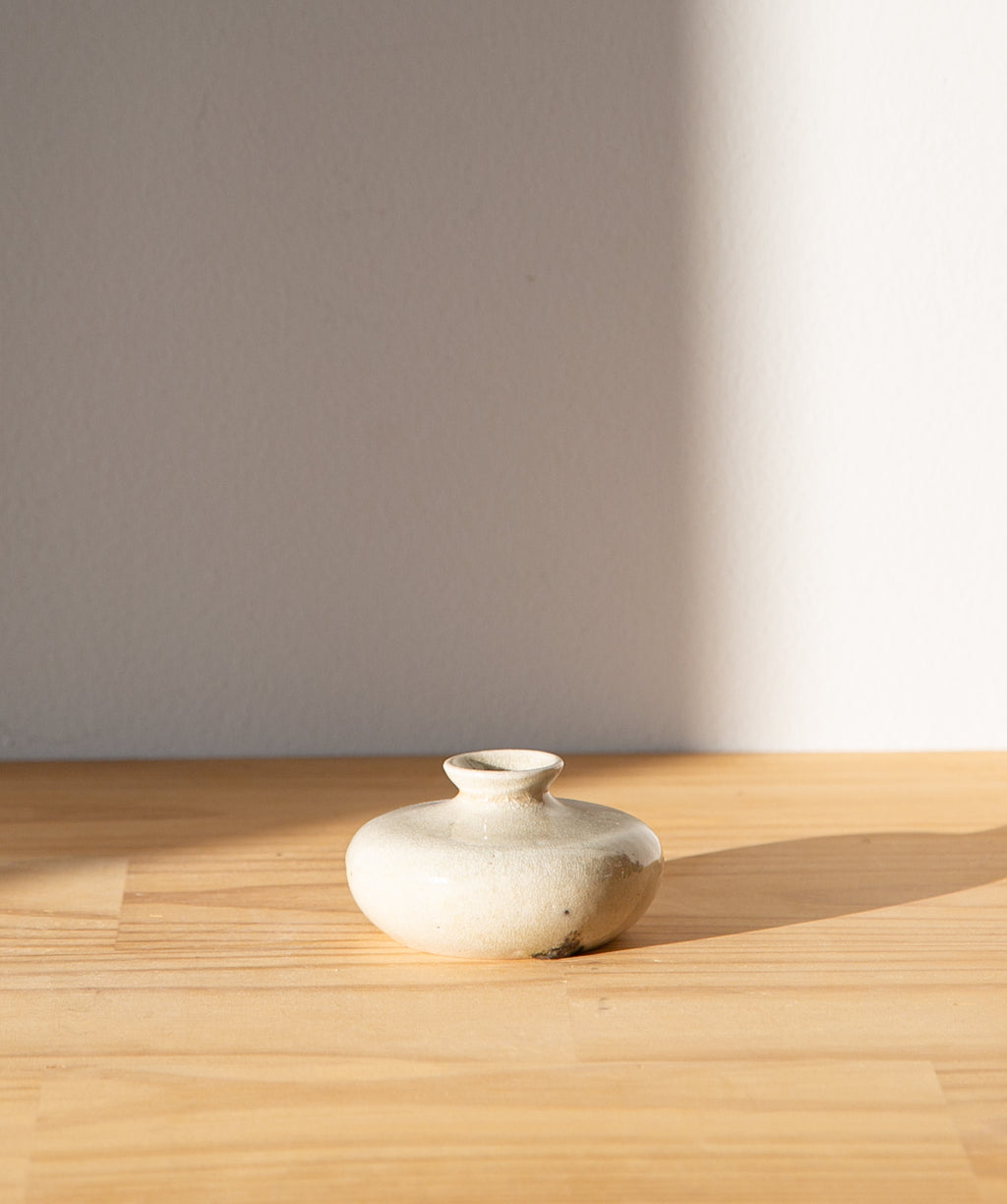 Cream-colored oil jar