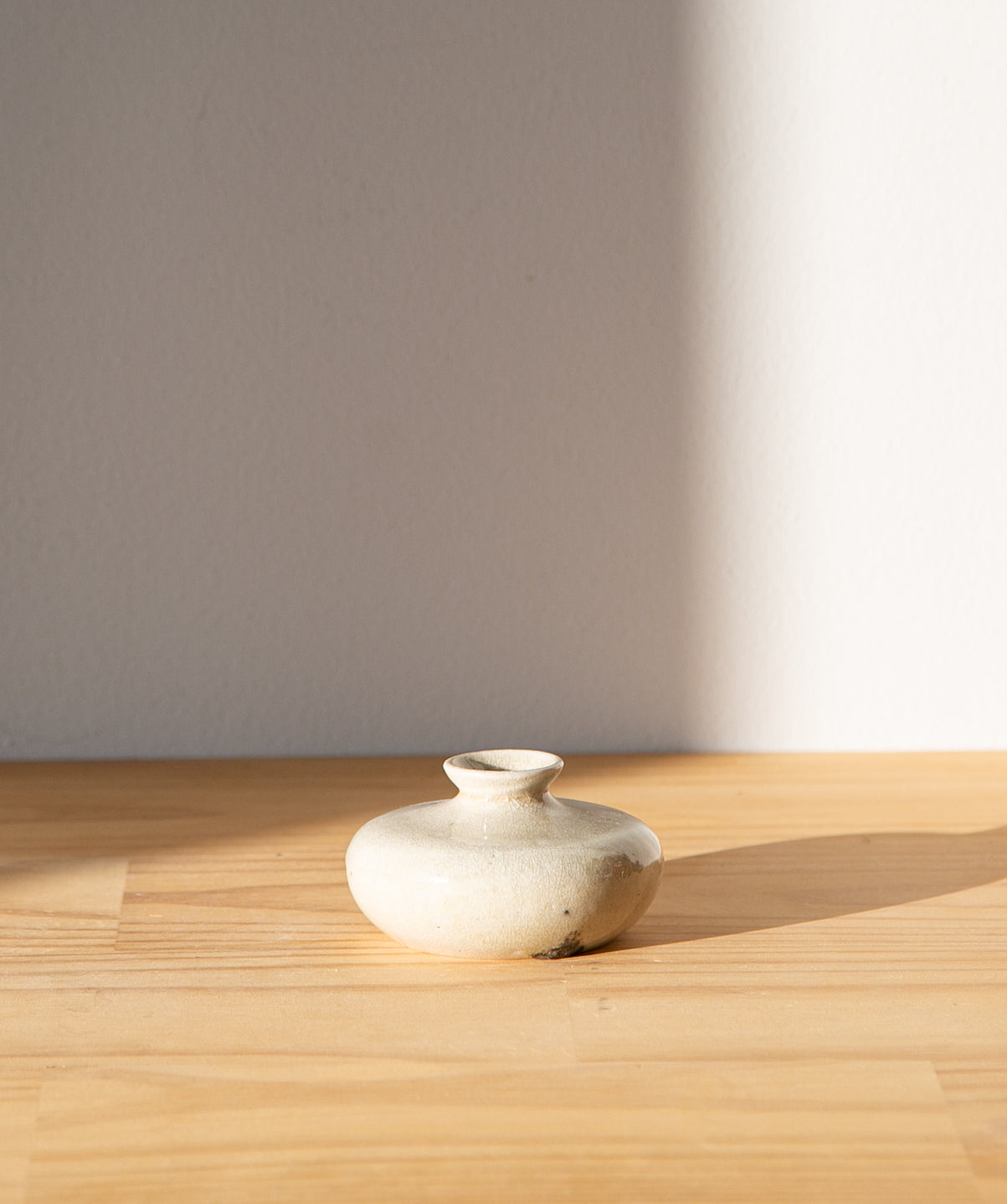 Cream-colored oil jar