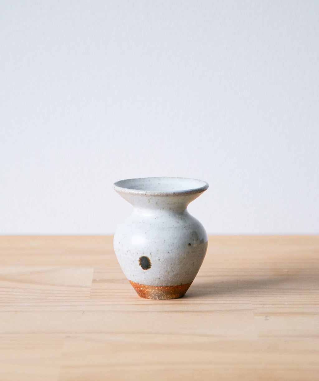 White tulip vase with iron mark