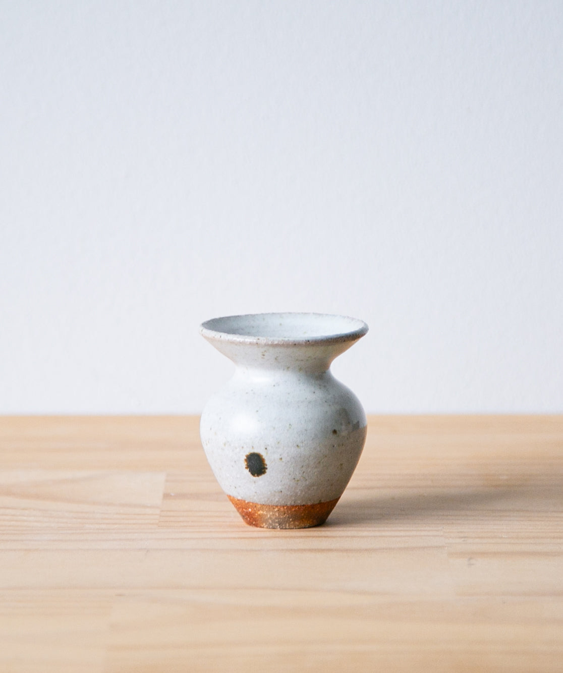 White tulip vase with iron mark