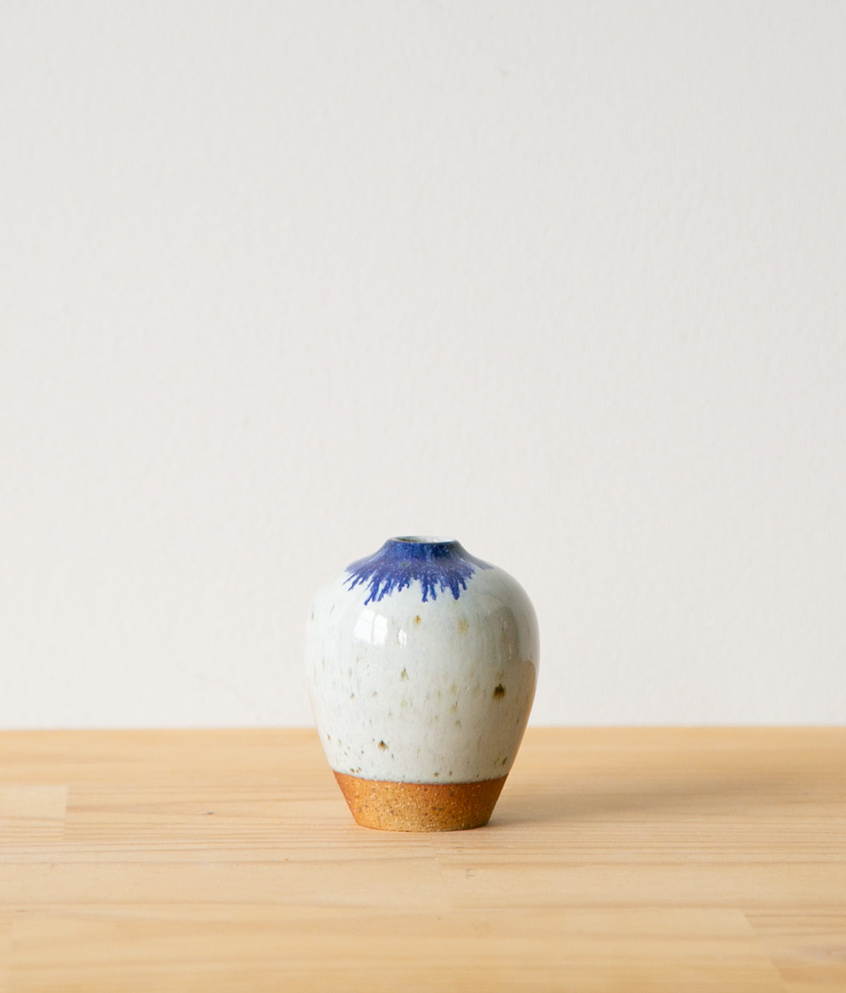 White vase with cobalt feathering