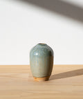 Pale blue bud vase