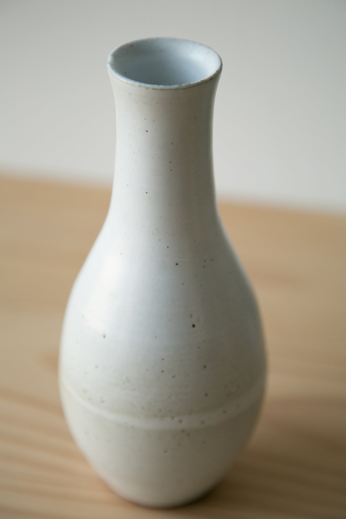 slim white bud vase